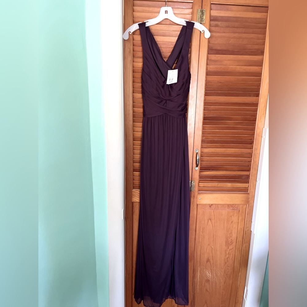 Never worn, NWT, Plum Long mesh Dress w/ a V-neckline & crisscross back straps.